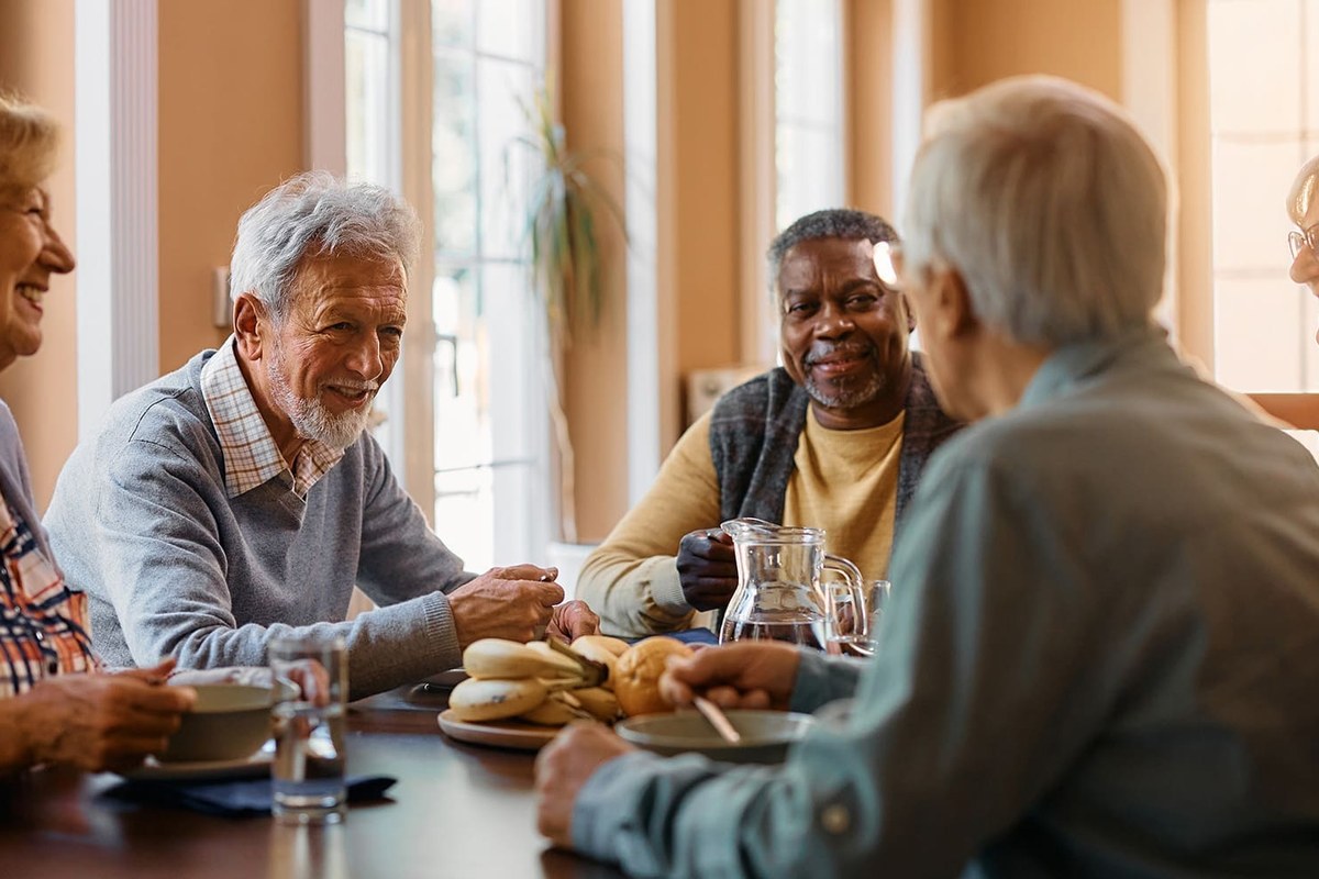 An older couple sharing a meal, representing the families Bridge to Better Living serves