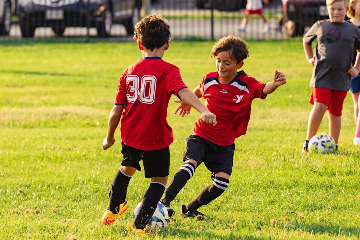 Children playing in a YMCA of Central Texas youth soccer program.